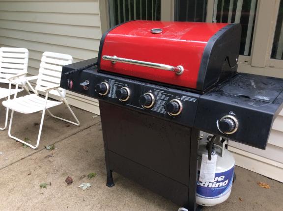 Barbecue/new propane can/lawn chair for sale in Troy MI