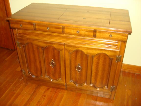 Cabinet with sewing machine for sale in Saint Marys PA