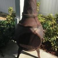Cast Iron Ouutdoor Firebox with Tall  chimney for sale in Jensen Beach FL by Garage Sale Showcase member Meliss, posted 10/20/2018