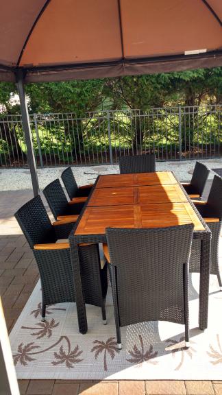 Teak and resin outdoor table andeight chairs for sale in Tinton Falls NJ