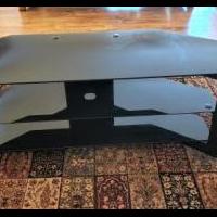 Glass TV stand. for sale in Naples FL by Garage Sale Showcase member Bunecky, posted 05/10/2022