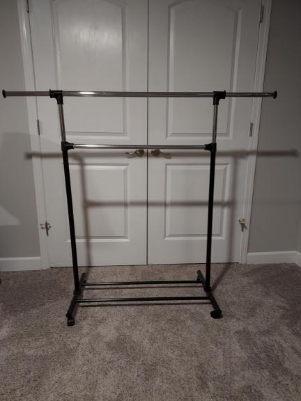 Clothes rack, on rollers, adjust 3 ways, sturdy for sale in Toledo OH