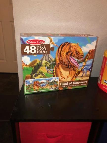 2 tier shelf with 6 bins and early learning stuff