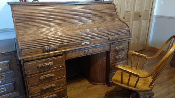 Oak roll top desk with chair.