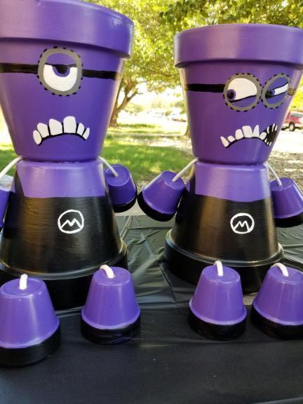 Purple minion clay pot people set of 2 for sale in Lubbock TX