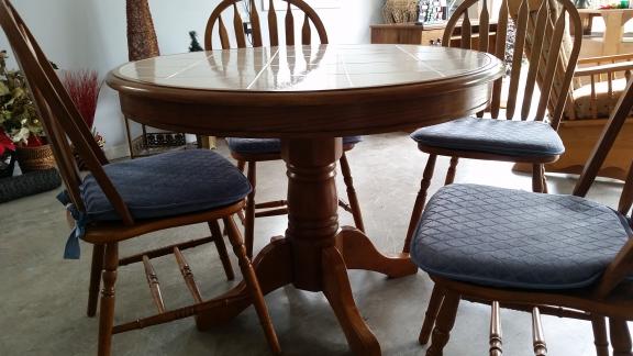 42" Round tile top pedistal table + 4 chairs for sale in Pinehurst NC