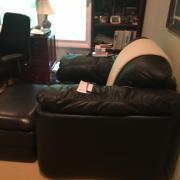 Overstuffed black leather chair and matching ottoman for sale in Edison NJ