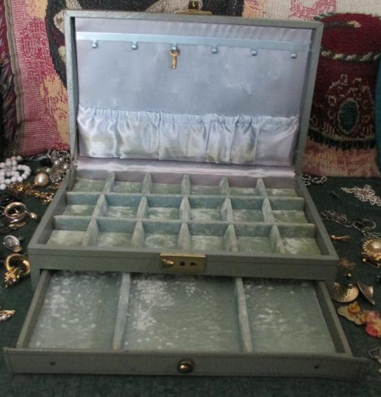 Vintage jewelry box full of vintage costume jewelry.