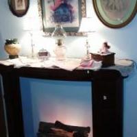 Fireplace Mantel with lit log unit for sale in Norwalk OH by Garage Sale Showcase member victorian, posted 07/25/2018